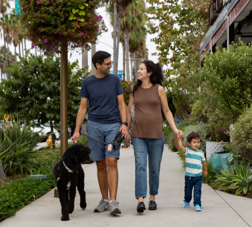 Family walking with dog